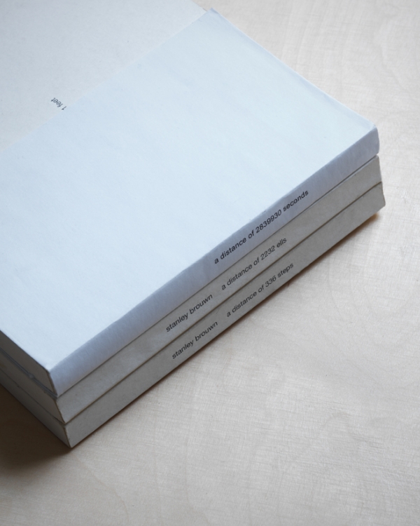'A Distance of 2839930 Seconds', 2010, paper cover on three artist books by Stanley Brouwn. 'A Distance of 2839930 Seconds', 2010, paper cover on three artist books by Stanley Brouwn.